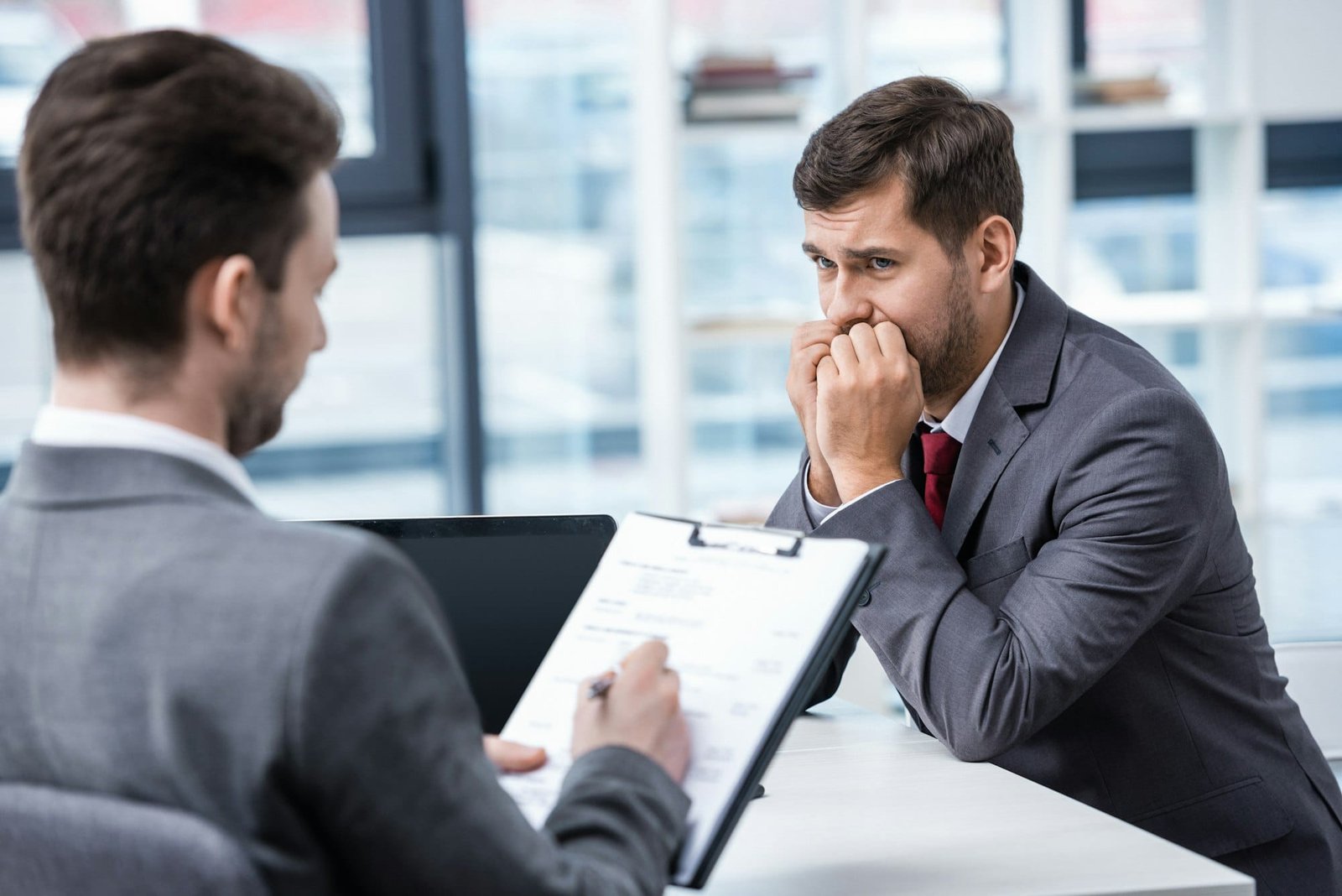 Nervous man wishing he enrolled in the RezzyCheck Interview Preparation course