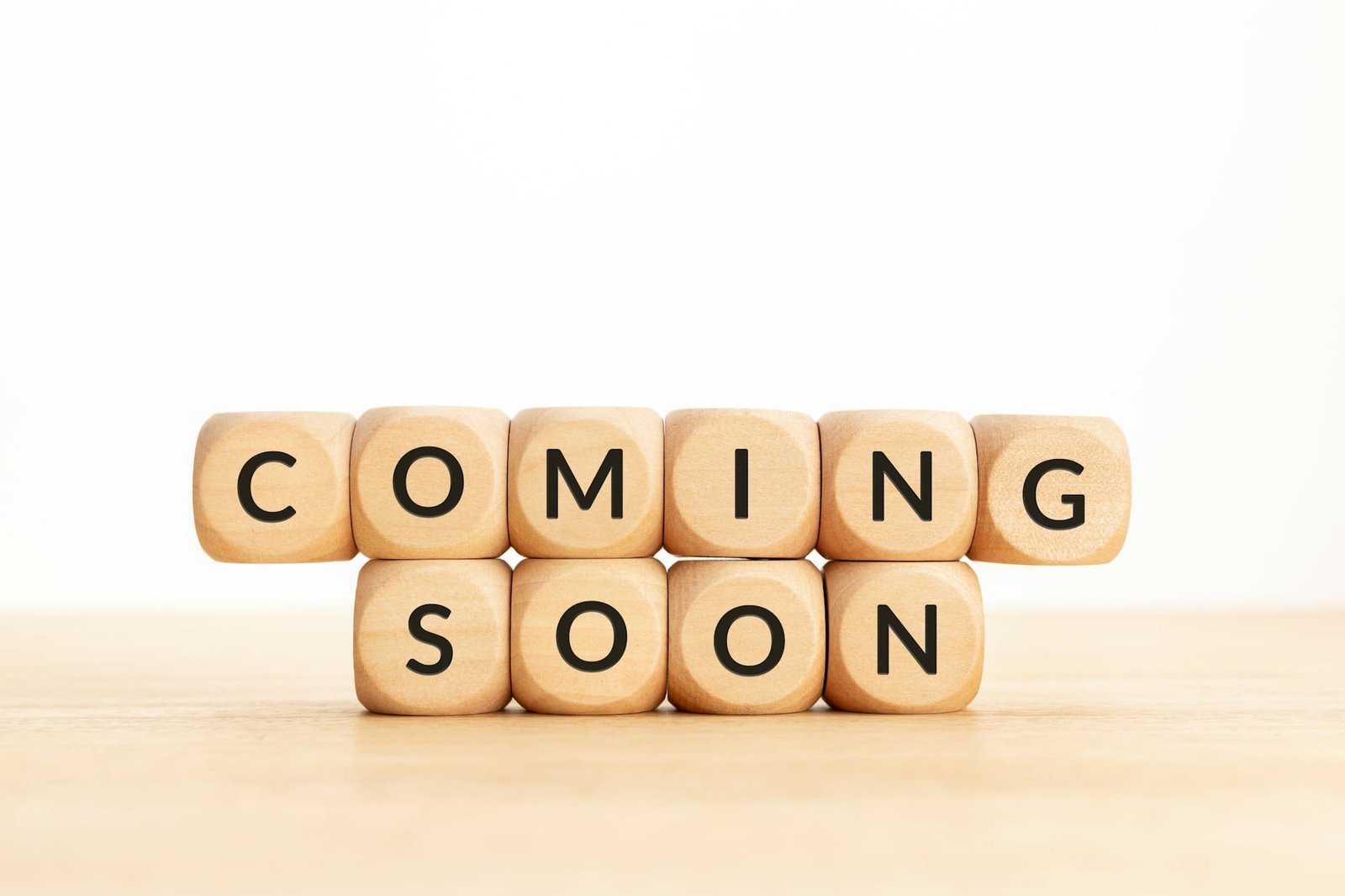 Coming soon phrase on wooden blocks